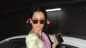 Kangana Ranaut was spotted at the airport in a pink sari and two folded braids.(Viral Bhayani) Kangana Ranaut was spotted at the airport in a pink sari and two folded braids.(Viral Bhayani)