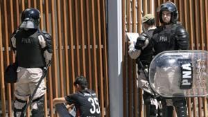 Security forces detain a River Plate's supporter outside the Monumental stadium in Buenos Aires.(AFP) Security forces detain a River Plate's supporter outside the Monumental stadium in Buenos Aires.(AFP)