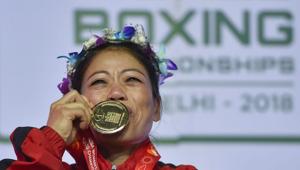 New Delhi: Indian boxer Mary Kom kisses her gold medal after winning the final match of women's light flyweight 45-48 kg against Ukraine's Hanna Okhota at AIBA Women's World Boxing Championships(PTI)