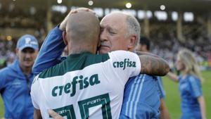 Palmeiras coach Luiz Felipe Scolari celebrates with Felipe Melo after winning the Brasileiro Championship title.(REUTERS) Palmeiras coach Luiz Felipe Scolari celebrates with Felipe Melo after winning the Brasileiro Championship title.(REUTERS)