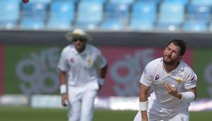 Pakistani spinner Yasir Shah delivers the ball during the third day of the second Test cricket match between Pakistan and New Zealand at the Dubai International Stadium in Dubai on November 26, 2018(AFP)