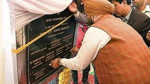 Punjab minister SS Randhawa covers Congress leaders’ names with black tape to avoid sharing space with Akalis on the foundation stone of the Kartarpur corridor project in Gurdaspur on Monday.(ANI Photo) Punjab minister SS Randhawa covers Congress leaders’ names with black tape to avoid sharing space with Akalis on the foundation stone of the Kartarpur corridor project in Gurdaspur on Monday.(ANI Photo)