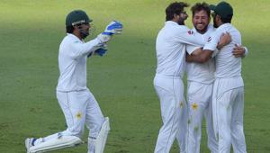 Pakistani cricketer Yasir Shah (2nd R) celebrates with teammate Hasan Ali (R), Imam-ul-Haq and captain Sarfraz Ahmed (L) after taking the final wicket of New Zealand batsman Trent Boult(AFP) Pakistani cricketer Yasir Shah (2nd R) celebrates with teammate Hasan Ali (R), Imam-ul-Haq and captain Sarfraz Ahmed (L) after taking the final wicket of New Zealand batsman Trent Boult(AFP)