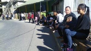 Voters wait outside a polling booth in Aizawl South. Unlike many other states, provision is made for voters to sit outside polling booths while waiting for their turn. Voters wait outside a polling booth in Aizawl South. Unlike many other states, provision is made for voters to sit outside polling booths while waiting for their turn.