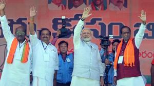 Prime Minister Narendra Modi waves at the crowd during an election rally in support of BJP candidates, in Mahbubnagar on November 27.(PTI Photo) Prime Minister Narendra Modi waves at the crowd during an election rally in support of BJP candidates, in Mahbubnagar on November 27.(PTI Photo)