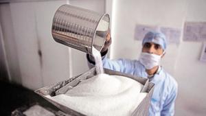 A worker fills sugar into a machine making sugar cubes at a sugar making unit in Ghaziabad, Uttar Pradesh. (Image for representation)(Bloomberg file photo) A worker fills sugar into a machine making sugar cubes at a sugar making unit in Ghaziabad, Uttar Pradesh. (Image for representation)(Bloomberg file photo)