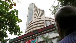 A man looks at a screen across a road displaying the Sensex on the facade of the Bombay Stock Exchange (BSE) building in Mumbai(REUTERS) A man looks at a screen across a road displaying the Sensex on the facade of the Bombay Stock Exchange (BSE) building in Mumbai(REUTERS)