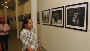 A woman takes a look at a photography exhibition in Chandigarh.(HT File)