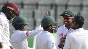 Bangladeshi cricketer Mehidy Hasan (R) celebrates with after the dismissal of West Indies cricketer Devendra Bishoo (L) during the third day of the second Test.(AFP) Bangladeshi cricketer Mehidy Hasan (R) celebrates with after the dismissal of West Indies cricketer Devendra Bishoo (L) during the third day of the second Test.(AFP)