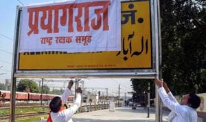 The file picture shows Rashtriya Rakshak Samuh activists covering Allahabad Railway Junction board with poster of 'Prayagraj' as Uttar Pradesh government Cabinet approves renaming of the city 'Allahabad' to 'Prayagraj' ahead of Kumbh Mela, in Allahabad.(PTI)