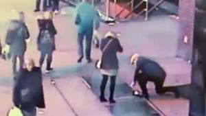 John Drennan and his fiancee, Daniella Anthony looking for the ring after it fell in the drain.(NYPD NEWS/Twitter) John Drennan and his fiancee, Daniella Anthony looking for the ring after it fell in the drain.(NYPD NEWS/Twitter)