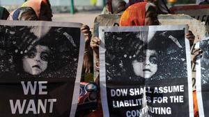 Bhopal gas disaster survivors hold posters during a protest rally in Bhopal(AFP) Bhopal gas disaster survivors hold posters during a protest rally in Bhopal(AFP)