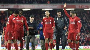 Liverpool coach Juergen Klopp (second from right) celebrates with the players after Divock Origi scored on Sunday.(AP) Liverpool coach Juergen Klopp (second from right) celebrates with the players after Divock Origi scored on Sunday.(AP)