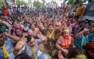 Kashmiri Pandits took out a protest march in Anantnag Sunday demanding that a passage(PTI) Kashmiri Pandits took out a protest march in Anantnag Sunday demanding that a passage(PTI)