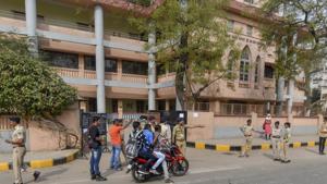 Police outside an examination centre for the Gujarat Police constable recruitment exam in Ahmedabad on Sunday. The exam was cancelled allegedly due to paper leak.(PTI) Police outside an examination centre for the Gujarat Police constable recruitment exam in Ahmedabad on Sunday. The exam was cancelled allegedly due to paper leak.(PTI)