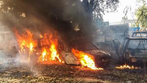 Vehicles set on fire by a mob during a protest over the alleged illegal slaughter of cattle, in Bulandshahr.(PTI Photo) Vehicles set on fire by a mob during a protest over the alleged illegal slaughter of cattle, in Bulandshahr.(PTI Photo)