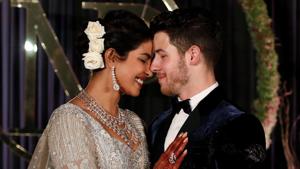Bollywood actor Priyanka Chopra and her husband singer Nick Jonas pose during a photo opportunity at their wedding reception.(REUTERS) Bollywood actor Priyanka Chopra and her husband singer Nick Jonas pose during a photo opportunity at their wedding reception.(REUTERS)