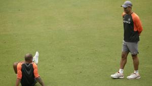 Indian cricketer M S Dhoni, right, and Shikhar Dhawan talk during a practice session.(AP) Indian cricketer M S Dhoni, right, and Shikhar Dhawan talk during a practice session.(AP)