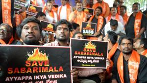 Members of the Sabarimala Ayyappa Seva Samajam pose with placards during a protest in Hyderabad on November 20, 2018, following the arrest of devotees at Sabarimala temple in Kerala.(AFP) Members of the Sabarimala Ayyappa Seva Samajam pose with placards during a protest in Hyderabad on November 20, 2018, following the arrest of devotees at Sabarimala temple in Kerala.(AFP)