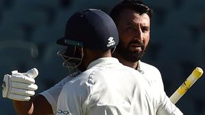 Cheteshwar Pujara celebrates his century against Australia with teammate Mohammed Shami (L).(AFP) Cheteshwar Pujara celebrates his century against Australia with teammate Mohammed Shami (L).(AFP)