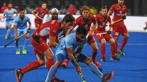 India's Manpreet Singh (C) tries to dribble past Belgium players during the field hockey group stage match between India and Belgium at the 2018 Hockey World in Bhubaneswar on December 2, 2018)(AFP) India's Manpreet Singh (C) tries to dribble past Belgium players during the field hockey group stage match between India and Belgium at the 2018 Hockey World in Bhubaneswar on December 2, 2018)(AFP)