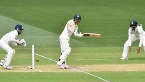 Australia's batsman Travis Head (C) plays a shot on day two of the first test match between Australia and India at the Adelaide Oval.(REUTERS) Australia's batsman Travis Head (C) plays a shot on day two of the first test match between Australia and India at the Adelaide Oval.(REUTERS)