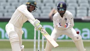 Australia's Usman Khawaja plays at the ball as India's Rishabh Pant, right, watches.(AP) Australia's Usman Khawaja plays at the ball as India's Rishabh Pant, right, watches.(AP)