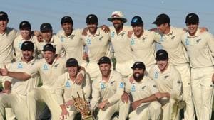 New Zealand cricketers pose with the winner's trophy following the third and final Test cricket match between Pakistan and New Zealand at the Sheikh Zayed International Cricket Stadium in Abu Dhabi.(AFP)