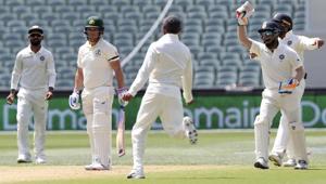 Indian players celebrate the dismissal of Australia's Aaron Finch, second left.(AP) Indian players celebrate the dismissal of Australia's Aaron Finch, second left.(AP)