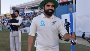New Zealand cricketer Ajaz Patel (R) and Will Somerville (2nd L, background) celebrate as they return to the pavilion after their victory against Pakistan on the third and final Test cricket match between Pakistan and New Zealand(AFP)