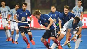 France's Hugo Genestet(C) is challenged by Argentina's Juan Gilardi (2R) during the field hockey group stage match between France and Argentina at the 2018 Hockey World Cup in Bhubaneswar on December 6, 2018.(AFP) France's Hugo Genestet(C) is challenged by Argentina's Juan Gilardi (2R) during the field hockey group stage match between France and Argentina at the 2018 Hockey World Cup in Bhubaneswar on December 6, 2018.(AFP)