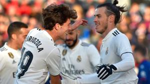 Gareth Bale (R) is congratulated by teammate defender Alvaro Odriozola after scoring his team's first goal.(AFP) Gareth Bale (R) is congratulated by teammate defender Alvaro Odriozola after scoring his team's first goal.(AFP)