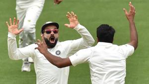 TOPSHOT - India's captain Virat Kohli (L) celebrates with spin bowler Ravichandran Ashwin (R) after beating Australia on day five of the first Test cricket match at the Adelaide Oval on December 10, 2018.(AFP) TOPSHOT - India's captain Virat Kohli (L) celebrates with spin bowler Ravichandran Ashwin (R) after beating Australia on day five of the first Test cricket match at the Adelaide Oval on December 10, 2018.(AFP)