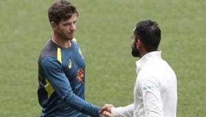 Australian captain Tim Paine (left) congratulates Virat Kohli after India won the first Test by 31 runs in Adelaide.(AP) Australian captain Tim Paine (left) congratulates Virat Kohli after India won the first Test by 31 runs in Adelaide.(AP)