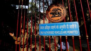 A security guard stands at the gate of the Reserve Bank of India (RBI) headquarters in New Delhi, India.(Bloomberg) A security guard stands at the gate of the Reserve Bank of India (RBI) headquarters in New Delhi, India.(Bloomberg)