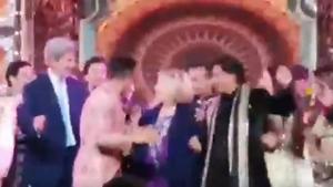 John Kerry and Hillary Clinton grooving with Shah Rukh Khan at Isha Ambani’s sangeet in Udaipur.(Twitter)
