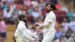 India's captain Virat Kohli (L) celebrates with his teammate Ishant Sharma after the dismissal of Australia's captain Tim Paine for 5 runs on day two of the first test match between Australia and India at the Adelaide Oval.(REUTERS) India's captain Virat Kohli (L) celebrates with his teammate Ishant Sharma after the dismissal of Australia's captain Tim Paine for 5 runs on day two of the first test match between Australia and India at the Adelaide Oval.(REUTERS)