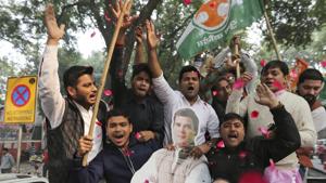 Congress party supporters hold a cut-out of party President Rahul Gandhi and celebrate outside the party headquarters in New Delhi, India, Tuesday, Dec. 11, 2018.(AP Photo) Congress party supporters hold a cut-out of party President Rahul Gandhi and celebrate outside the party headquarters in New Delhi, India, Tuesday, Dec. 11, 2018.(AP Photo)