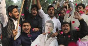 Assembly elections 2018: Congress party supporters hold a cut-out of party President Rahul Gandhi and celebrate outside the party headquarters in New Delhi.(AP) Assembly elections 2018: Congress party supporters hold a cut-out of party President Rahul Gandhi and celebrate outside the party headquarters in New Delhi.(AP)