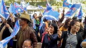 Mizoram assembly elections 2018: Mizo National Front (MNF) workers hold up party flag as they celebrate the party's victory in the Assembly elections, in Aizawl.(PTI) Mizoram assembly elections 2018: Mizo National Front (MNF) workers hold up party flag as they celebrate the party's victory in the Assembly elections, in Aizawl.(PTI)