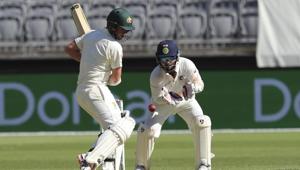Australia's Travis Head plays a shot in front of India's wicketkeeper Rishabh Pant during play in the second cricket test between Australia and India in Perth, Australia, Friday, Dec. 14, 2018. (AP Photo/Trevor Collens)(AP) Australia's Travis Head plays a shot in front of India's wicketkeeper Rishabh Pant during play in the second cricket test between Australia and India in Perth, Australia, Friday, Dec. 14, 2018. (AP Photo/Trevor Collens)(AP)