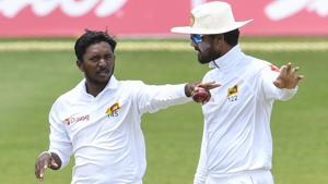 File image - Akila Dananjaya (L) and Dinesh Chandimal (R) of Sri Lanka set the field during a Test match.(AFP) File image - Akila Dananjaya (L) and Dinesh Chandimal (R) of Sri Lanka set the field during a Test match.(AFP)