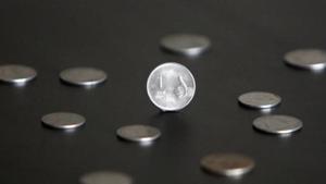 A one rupee coin is seen in this picture illustration taken in Mumbai.(Reuters) A one rupee coin is seen in this picture illustration taken in Mumbai.(Reuters)