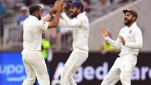 India's Mohammed Shami (L) is congratulated by teammates Lokesh Rahul (C) and Virat Kohli (R) after dismissing Australian batsman Shaun Marsh.(AFP) India's Mohammed Shami (L) is congratulated by teammates Lokesh Rahul (C) and Virat Kohli (R) after dismissing Australian batsman Shaun Marsh.(AFP)