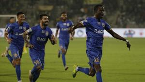 Modou Sougou, right, of Mumbai City FC celebrates with his team players after scoring a goal against Kerala Football FC.(AP) Modou Sougou, right, of Mumbai City FC celebrates with his team players after scoring a goal against Kerala Football FC.(AP)