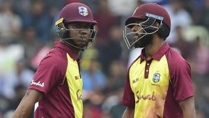 West Indies cricketer Evin Lewis (L) talks to his teammate Shai Hope (R) during the first Twenty20 (T20) cricket match.(AFP) West Indies cricketer Evin Lewis (L) talks to his teammate Shai Hope (R) during the first Twenty20 (T20) cricket match.(AFP)