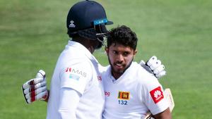 Sri Lanka's Kusal Mendis (R) celebrates reaching his century (100 runs) with teammate Angelo Mathews during day four of the first Test cricket match between New Zealand and Sri Lanka at the Basin Reserve in Wellington.(AFP) Sri Lanka's Kusal Mendis (R) celebrates reaching his century (100 runs) with teammate Angelo Mathews during day four of the first Test cricket match between New Zealand and Sri Lanka at the Basin Reserve in Wellington.(AFP)