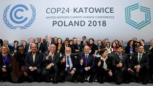 COP24 President Michal Kurtyka and Executive Secretary of the UN Framework Convention on Climate Change Patricia Espinosa pose with the heads of delegations after adopting the final agreement during a closing session of the COP24 UN Climate Change Conference 2018, Katowice, Poland, December 15(REUTERS) COP24 President Michal Kurtyka and Executive Secretary of the UN Framework Convention on Climate Change Patricia Espinosa pose with the heads of delegations after adopting the final agreement during a closing session of the COP24 UN Climate Change Conference 2018, Katowice, Poland, December 15(REUTERS)