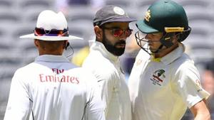 India's captain Virat Kohli (C) and Australia's captain Tim Paine react after Paine ran a single during play on day four of the second test match between Australia and India at Perth Stadium in Perth, Australia, December 17, 2018(REUTERS) India's captain Virat Kohli (C) and Australia's captain Tim Paine react after Paine ran a single during play on day four of the second test match between Australia and India at Perth Stadium in Perth, Australia, December 17, 2018(REUTERS)