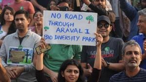 In October, hundreds of people came out to protest against a proposed six-lane expressway which would have cut into a third of the Aravalli Biodiversity Park’s 380 acres.(HT File) In October, hundreds of people came out to protest against a proposed six-lane expressway which would have cut into a third of the Aravalli Biodiversity Park’s 380 acres.(HT File)